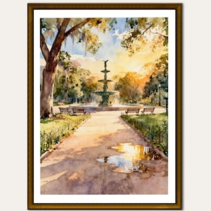 May include: Watercolour painting of a park scene with a fountain, benches, and trees. The artwork features a pathway leading to the fountain, with reflections in puddles. The painting is framed in a gold-coloured frame.