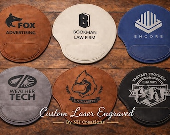 May include: A collection of custom laser-engraved mouse pads in various colors, including brown, gray, cream, and blue. Each pad features a unique design, such as a fox, a logo, and the text "Fantasy Football Champs."