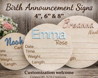 May include: Wooden birth announcement signs in various sizes, featuring names in blue and rose gold. Each sign includes space for date, time, weight, and length. The signs are round and have a natural wood grain finish.