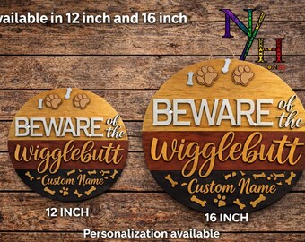 May include: Wooden round sign with the text "BEWARE of the Wigglebutt" and "Custom Name". Available in 12 inch and 16 inch sizes. The sign features paw prints and bone accents. Personalization is available.