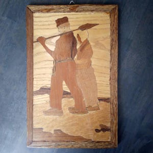 Wood inlay panel, Dutch Marqueterie, Depicting a Dutch man and woman in traditional clothing