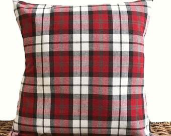 May include: Red, white, and black plaid throw pillow with a square shape.