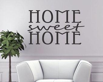 May include: Black and white vinyl wall decal with the text "Home sweet home" in a modern font.