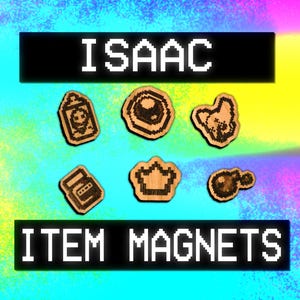 May include: A set of six wooden magnets featuring various items from the video game "The Binding of Isaac". The magnets are in the shape of a crown, a bomb, a dog, an eye, a key, and a vending machine. The magnets are all brown and have black outlines. The text "ISAAC" is at the top of the image and "ITEM MAGNETS" is at the bottom.