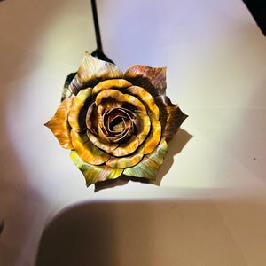 Hand forged and flame painted copper and steel rose.