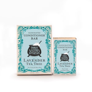 May include: Two bars of Three Sisters Apothecary Lavender Tea Tree conditioner. The larger bar is 4.75 ounces and the smaller bar is 1.75 ounces. Both bars are packaged in boxes with a vintage floral design.