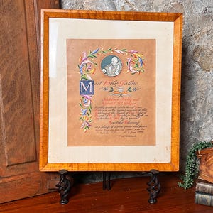 May include: A framed Apostolic Blessing document featuring a central portrait of the Pope, ornate floral calligraphy in red, blue, and green, and the text Most Holy Father, Kathleen Kelly and Gerald W. Colgan, dated September 9, 1961.