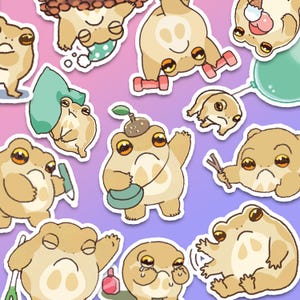May include: A collection of whimsical frog stickers in various poses and with different accessories. The frogs are tan with large, expressive eyes and are set against a gradient purple and pink background. Some frogs hold dumbbells, a balloon, or a pen.