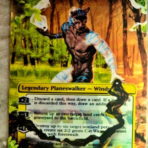 May include: A Magic: The Gathering card featuring a blue and white creature with a cat-like face. The card is titled "Lord Windgrace" and is a legendary planeswalker. The card has a green mana symbol and a 5 in the lower right corner.