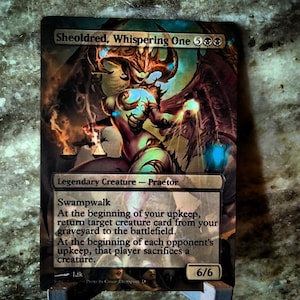May include: A Magic: The Gathering card featuring Sheoldred, Whispering One, a legendary creature with a 6/6 power and toughness. The card is illustrated with a dark, demonic figure with glowing eyes and a menacing expression. The card text reads "Swampwalk. At the beginning of your upkeep, return target creature card from your graveyard to the battlefield. At the beginning of each opponent's upkeep, that player sacrifices a creature."