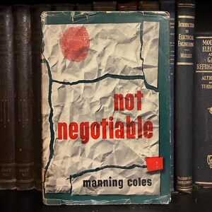 May include: Vintage book cover with the title "not negotiable" in red letters. The cover has a crumpled paper texture with a red fingerprint and a small red square. The author's name, Manning Coles, is at the bottom.