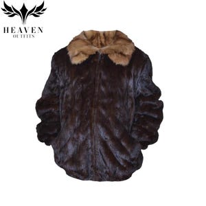May include: A dark brown faux fur jacket with a light brown collar. The jacket has a zipper closure and long sleeves. The logo "HEAVEN OUTFITS" is in the upper left corner.