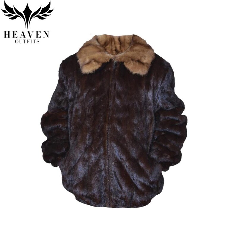 May include: A dark brown faux fur jacket with a light brown collar. The jacket has a zipper closure and long sleeves. The logo "HEAVEN OUTFITS" is in the upper left corner.
