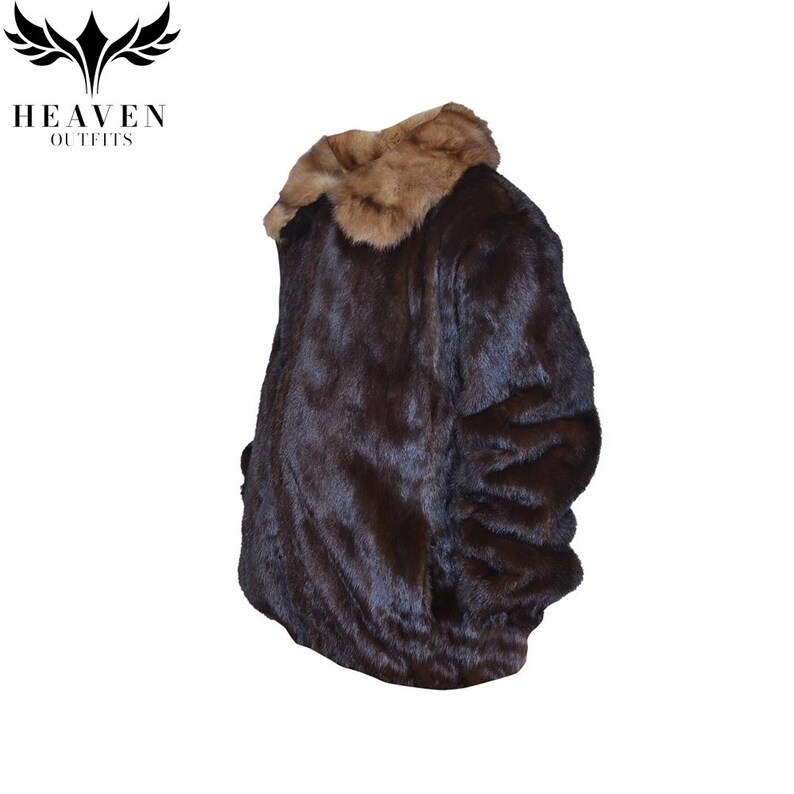 May include: A dark brown faux fur coat with a light brown fur collar. The coat has a soft, textured appearance and is designed with a classic silhouette. The logo "HEAVEN OUTFITS" is visible in the upper left corner.