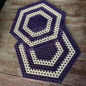 May include: A set of three ceramic nesting bowls in shades of blue, green, and white. The bowls have a speckled glaze and a simple, modern design. The largest bowl is about 15 cm in diameter.