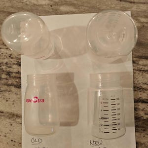 This photo is provided to help you figure out what version of the bottle you have. The new wide mouth type is shown on the right. It is flattened on one side. The old version is shown on the left. It is more symmetrical and like an oval in shape.