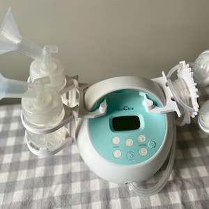 Breast pump bottle holders (on left) and tube holders (on right)