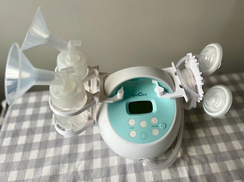Breast pump bottle holders (on left) and tube holders (on right)