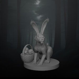 May include: A gray sculpture of a menacing rabbit with long ears and fangs, seated next to a basket filled with skulls. The rabbit is on a round base, set against a dark, blurred forest background.