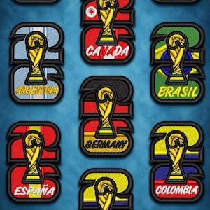 May include: A collection of twelve embroidered patches featuring the FIFA World Cup trophy centered over various national flags including the USA, Mexico, Canada, Argentina, Brazil, Germany, Spain, Colombia, Ecuador, Paraguay, and Uruguay.
