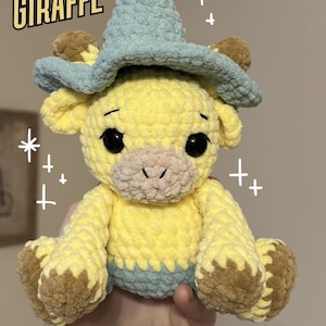 May include: A handmade, yellow crochet giraffe wearing a blue wizard's hat. The giraffe has brown hooves and ears, and black safety eyes. The text "Wizard Giraffe" and "PDF Crochet Pattern" are visible in the image.