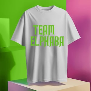 May include: White t-shirt with green text that reads "TEAM ELPHABA".