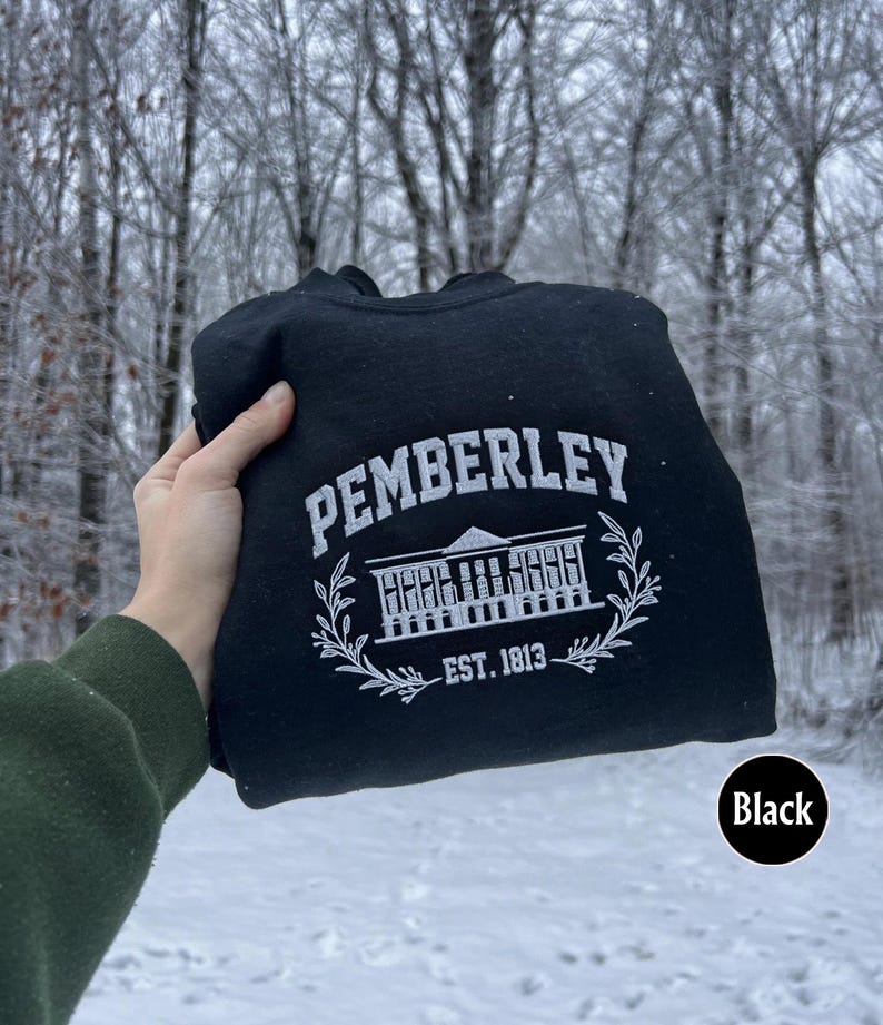 May include: Black hooded sweatshirt with a white graphic of a building with the text "Pemberley Est. 1813".