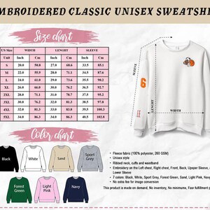 May include: White unisex sweatshirt with an embroidered design and the number 6 on the sleeve. The size chart shows measurements in inches and centimeters. Available in various colors, including black, white, and navy. The text on the image says "EMBROIDERED CLASSIC UNISEX SWEATSHIRT".