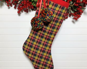 Tartan Plaid Flannel Christmas Stocking with Rainbow Pom Poms for a Festive and Whimsical Holiday Display