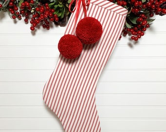 Red Pom Poms on Candy Cane Red Ticking Christmas Stocking | Cozy Flannel Lining | Traditional, Cottagecore and Farmhouse Holidays