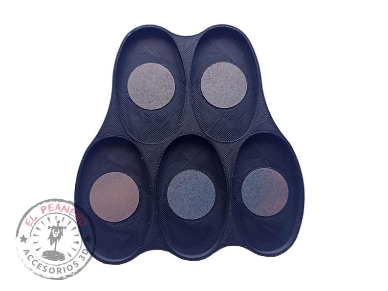 May include: Black plastic tray with six oval-shaped compartments. Each compartment has a circular indentation.