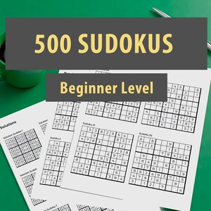 May include: A close-up of a printed sheet of paper with 500 Sudoku puzzles, labeled "Beginner Level". The paper is on a green surface with a cup of coffee.