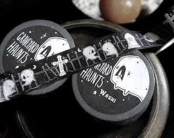 May include: Black and white washi tape with a repeating pattern of ghosts, fences, and tombstones. The tape reads "Graveyard Haunts" and "Washi".