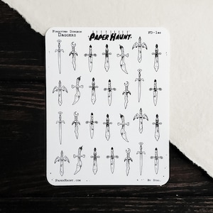 May include: A white sticker sheet featuring twenty-four black ink illustrations of various daggers. The text reads Forgotten Dungeon Daggers, Paper Haunt, FD-1bs, PaperHaunt.com, and By Stag. Each dagger has a unique hilt and blade design.
