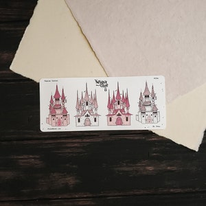May include: Four illustrations of pink and white castles with pointed roofs and towers. The illustrations are on a white background with the text "Vampire Castles" and "YawnYawn Craft" at the top.