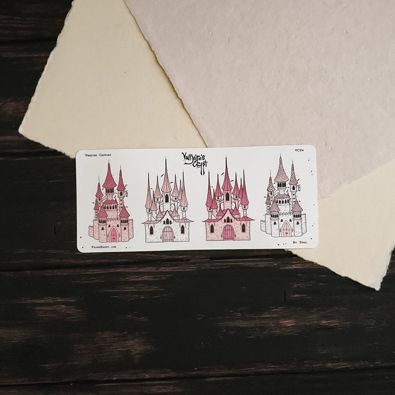 May include: Four illustrations of pink and white castles with pointed roofs and towers. The illustrations are on a white background with the text "Vampire Castles" and "YawnYawn Craft" at the top.