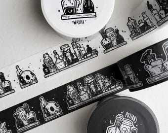 May include: Two rolls of washi tape featuring black and white illustrations of potion bottles, skulls, and books on shelves. One roll has a white background with black ink, and the other has a black background with white ink. The labels read POTIONS.