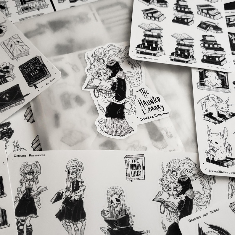 May include: A set of black and white stickers featuring illustrations of a haunted library, dragons, and books. The stickers are part of a sticker collection called "The Haunted Library".