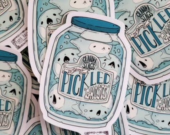 May include: A sticker featuring a hand-drawn illustration of a glass jar filled with pickled ghosts. The jar has a blue lid and a label that reads "Grandma Stag's Old Fashioned Pickled Ghosts".