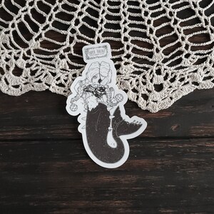 Gothic pirate mermaid sticker by artist White stag for Paper Haunt Stationery & Co on a doily