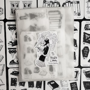 May include: A sticker sheet with a black and white illustration of a woman reading a book. The sticker sheet is titled "The Haunted Library Sticker Collection".