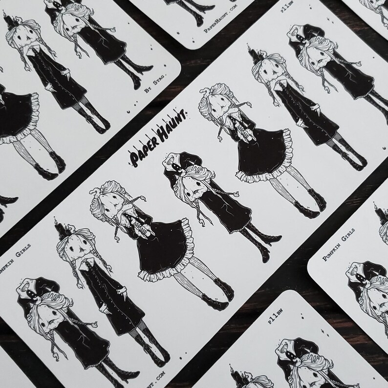 May include: A set of black and white stickers featuring illustrations of pumpkin girls with candles. The stickers are on a white background and have the text "Paper Haunt" and "By Strao" printed on them.