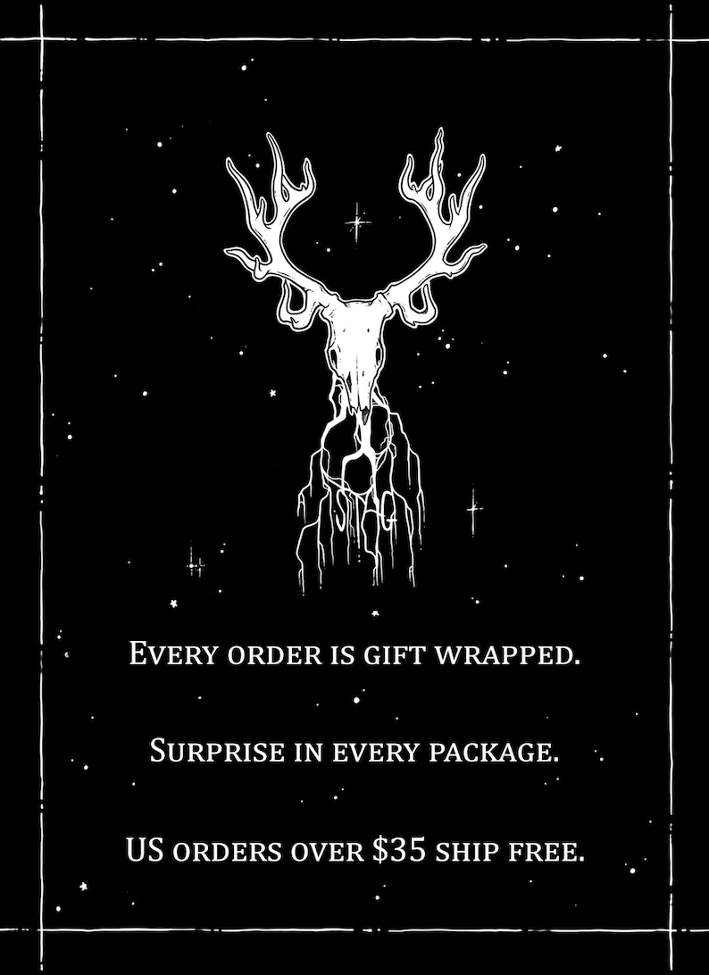 May include: Black and white illustration of a deer skull with antlers against a black background with white stars. The text "EVERY ORDER IS GIFT WRAPPED. SURPRISE IN EVERY PACKAGE. US ORDERS OVER $35 SHIP FREE." is below the image.