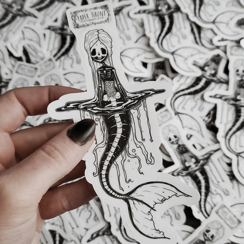 Spooky cute goth Jelly bones mermaid skeleton emerging from water, a sticker Featuring a Mermaid with Translucent skin with visible skeleton and organs.