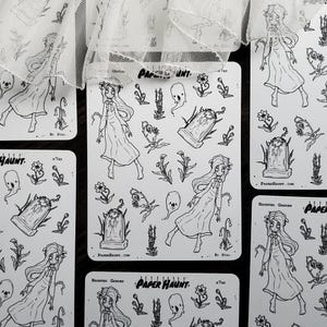 May include: A set of four black and white sticker sheets featuring a spooky garden theme. The stickers include a ghost, flowers, a tombstone, and a girl in a white dress. The text on the sticker sheets reads "Paper Haunt" and "Haunted Garden".