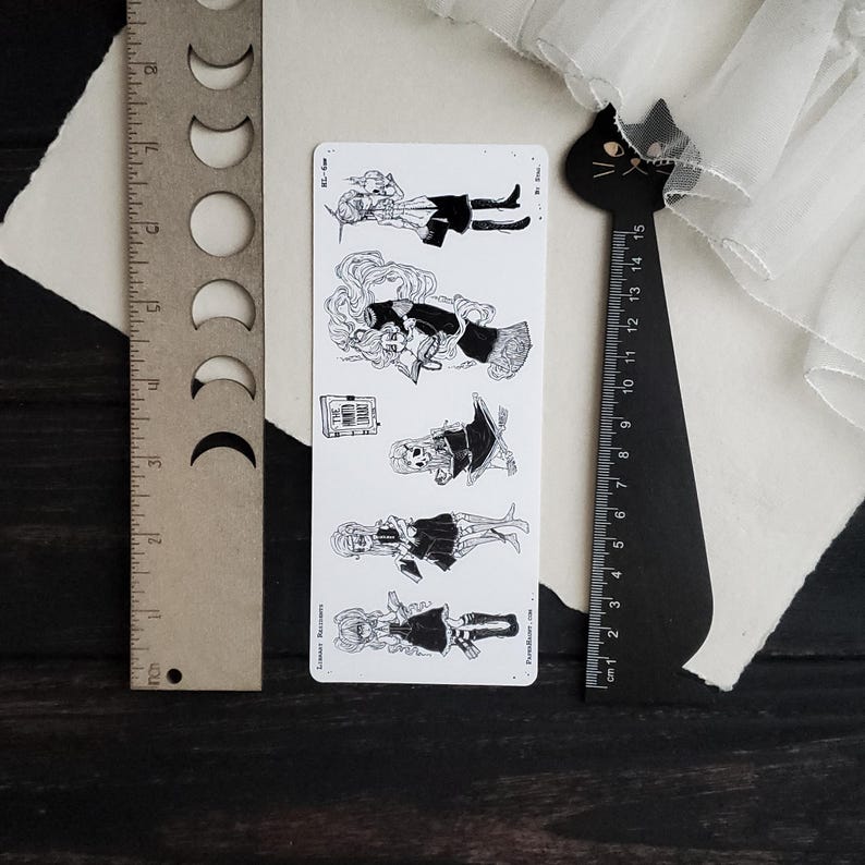 May include: A set of five black and white illustrations of women in various poses. Each illustration features a woman with long hair, wearing a dress and holding a book. The illustrations are printed on a white background.