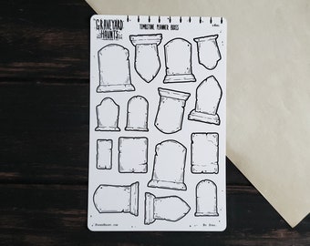 May include: A sheet of black and white tombstone planner stickers with the text "Graveyard Haunts" and "Tombstone Planner Boxes".