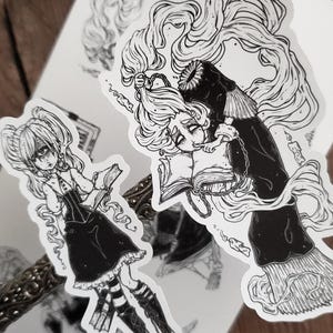 May include: Two black and white illustrations of women with long hair. One woman is holding a book and the other is holding a book and a candle. Both women are wearing dresses.