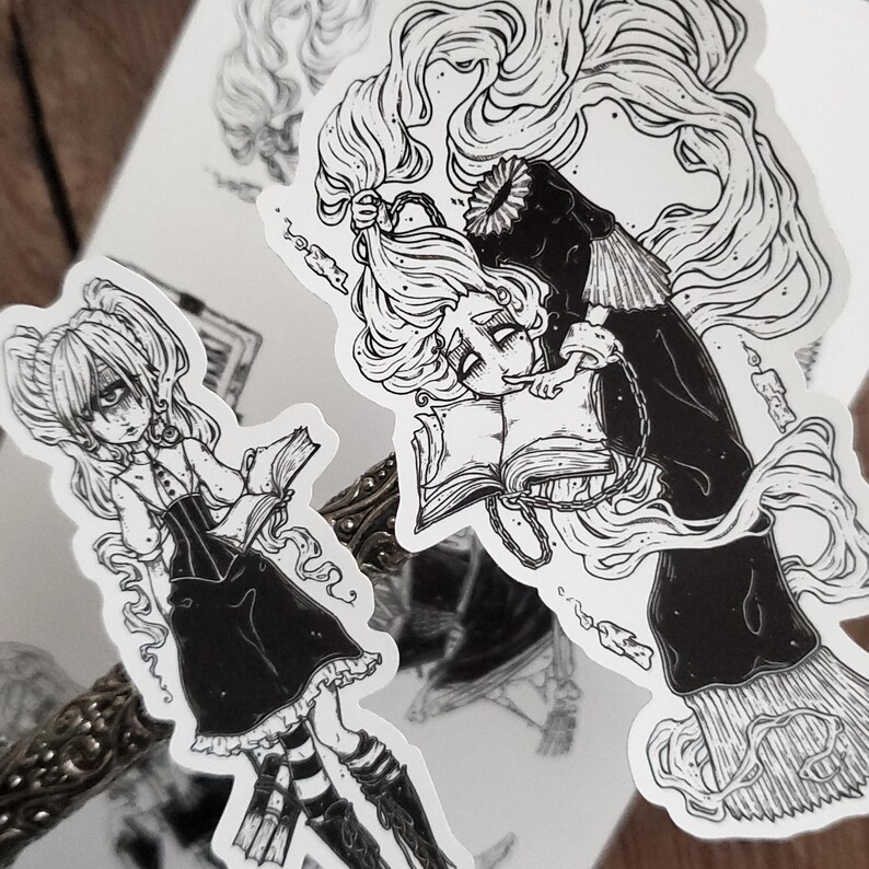 May include: Two black and white illustrations of women with long hair. One woman is holding a book and the other is holding a book and a candle. Both women are wearing dresses.