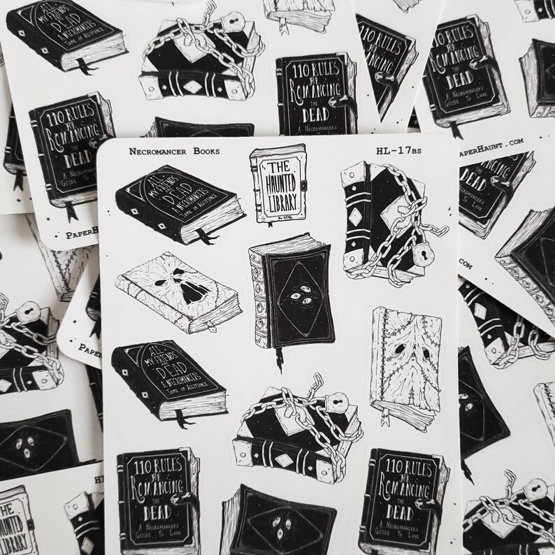 May include: A set of 10 black and white stickers featuring illustrations of books with titles like "All My Friends Are Dead", "The Haunted Library", and "110 Rules for Romancing the Dead". The stickers are part of a collection called "Necromancer Books" and are designed by Paper Haunt.